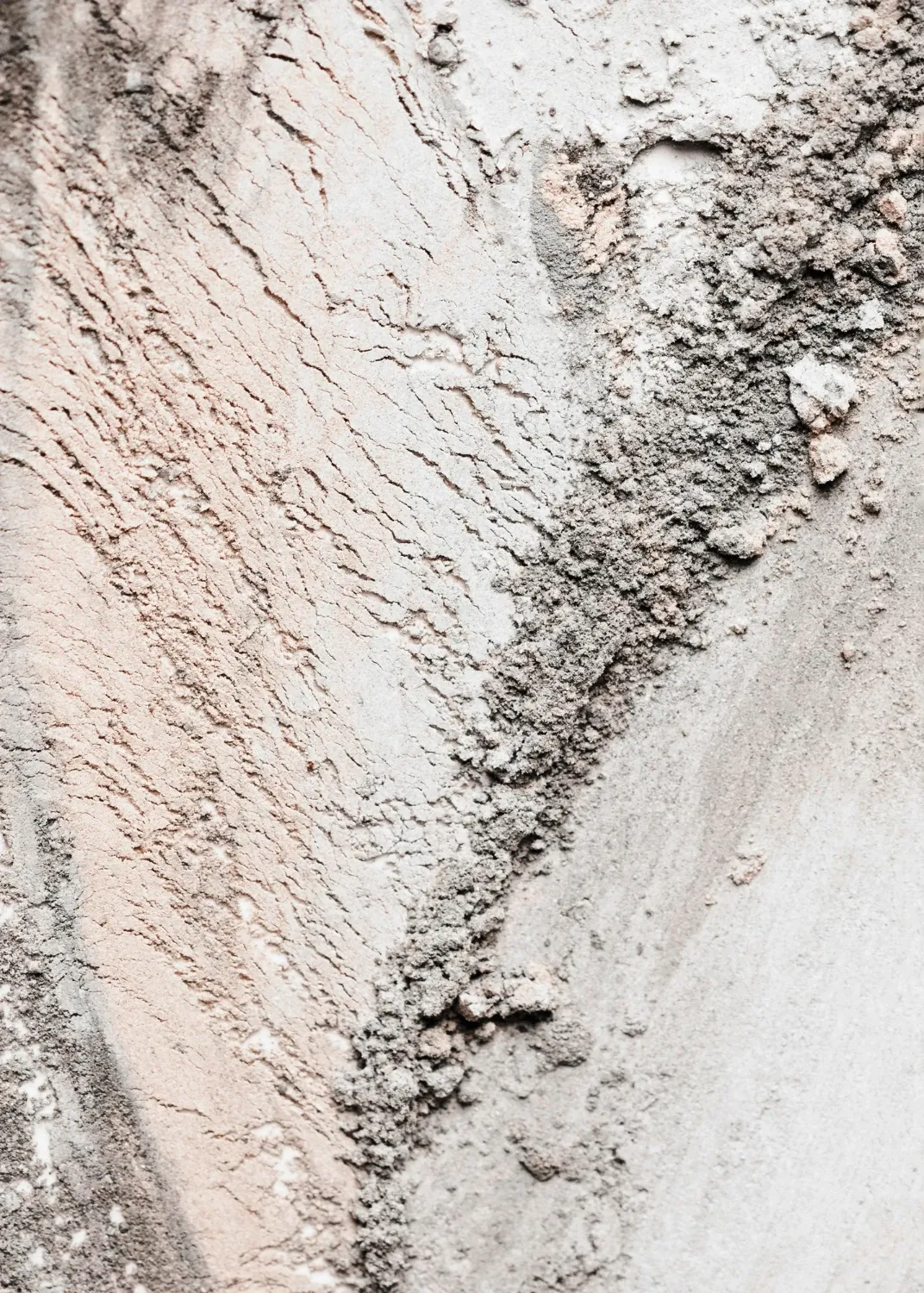 Macro view of pale mineral, showing its veining and layered structure.